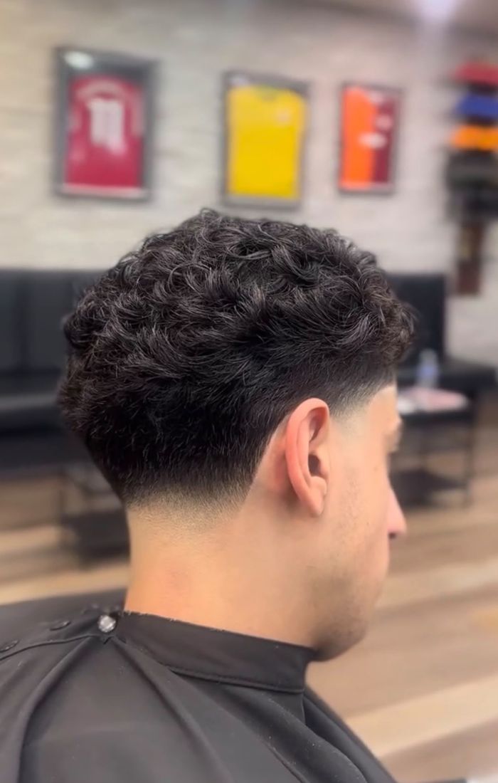 Curly top with low taper